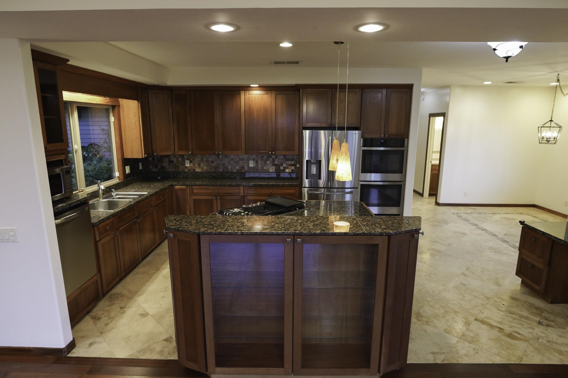 43 West Waipio Road Haiku, HI 96708 - Photo 24 of 44 a kitchen with stainless steel appliances granite countertop a sink stove and refrigerator