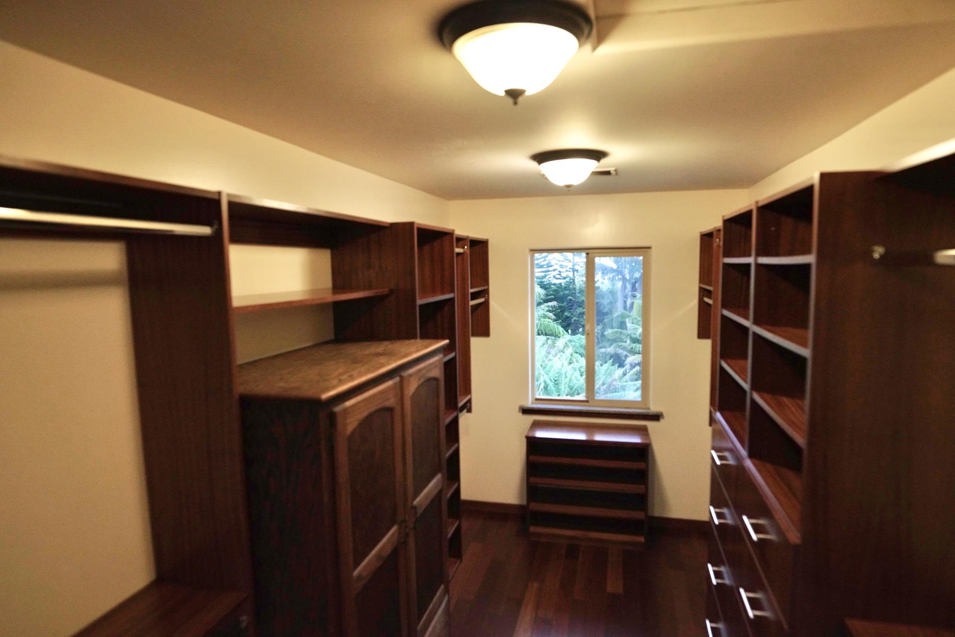 43 West Waipio Road Haiku, HI 96708 - Photo 7 of 44 a view of walk in closet with clothes and shoes