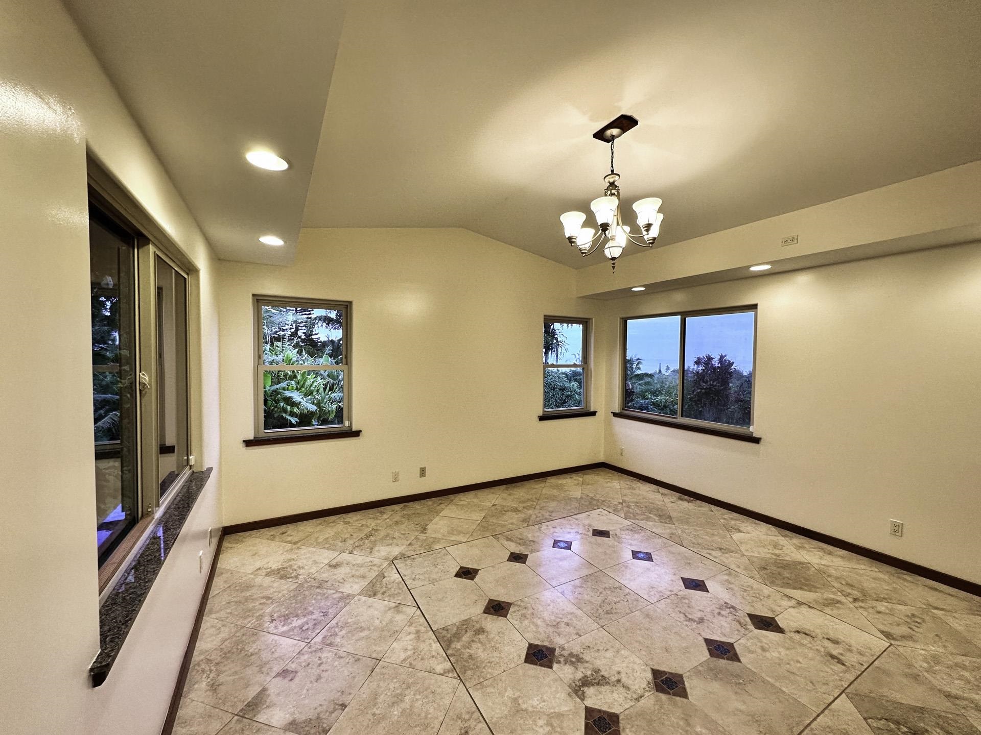 43 West Waipio Road Haiku, HI 96708 - Photo 10 of 44 a view of an empty room with window and chandelier fan