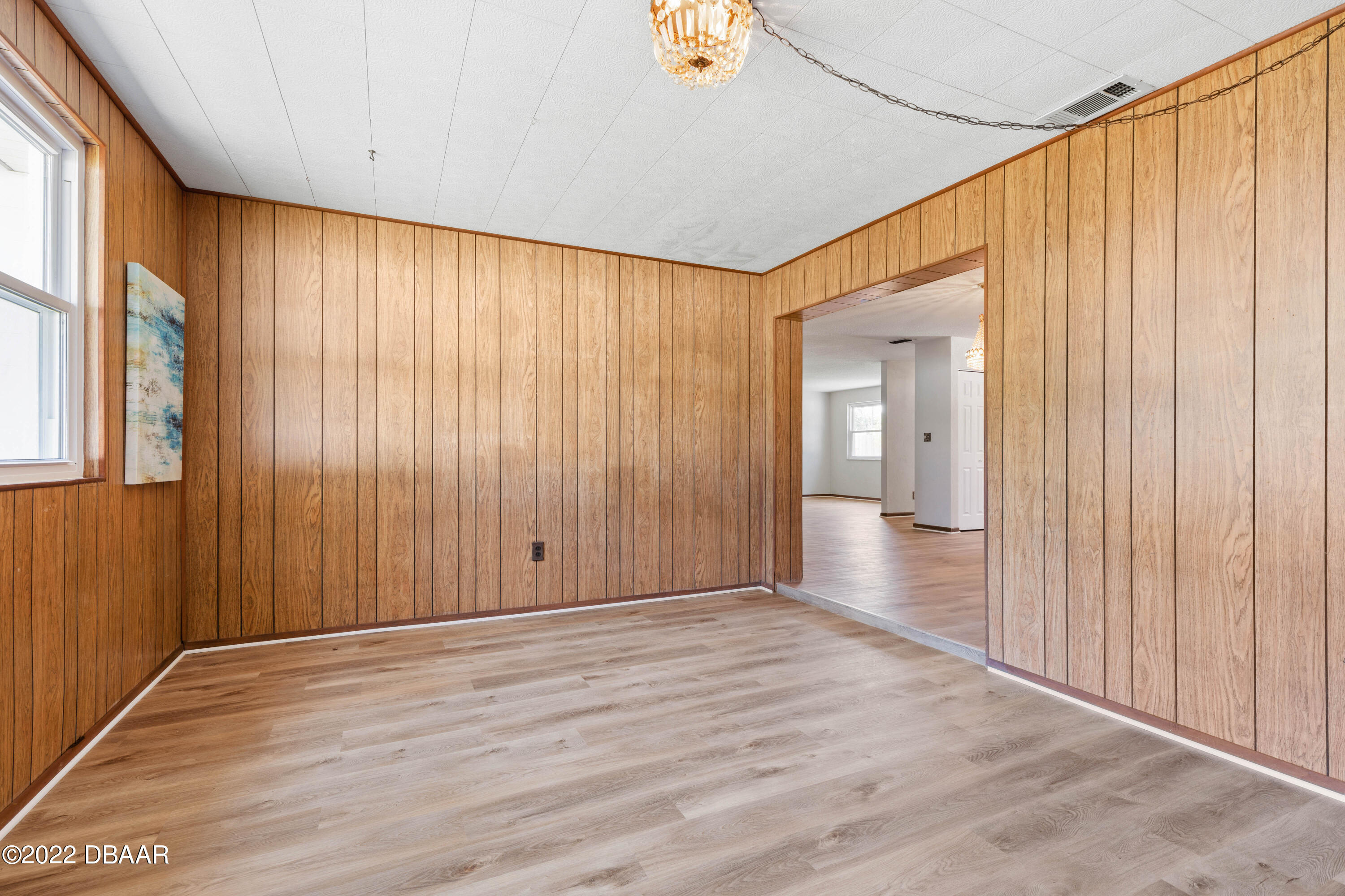 64 Cumberland Avenue Ormond Beach, FL 32174 - Photo 15 of 38 a view of wooden floor and windows in a room