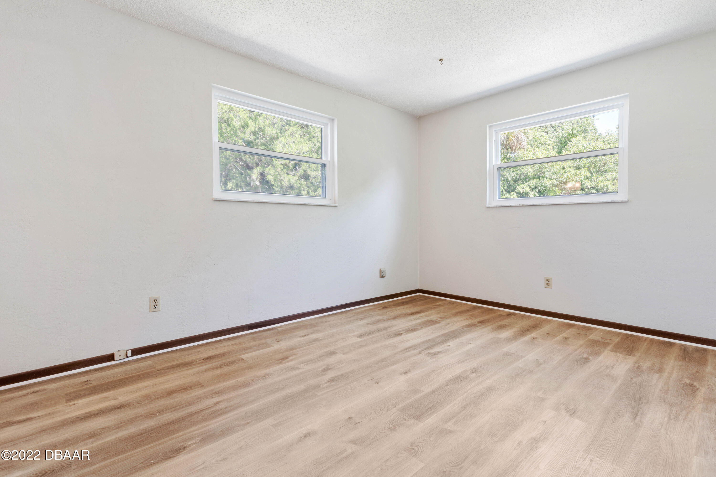 64 Cumberland Avenue Ormond Beach, FL 32174 - Photo 16 of 38 a view of an empty room with a window