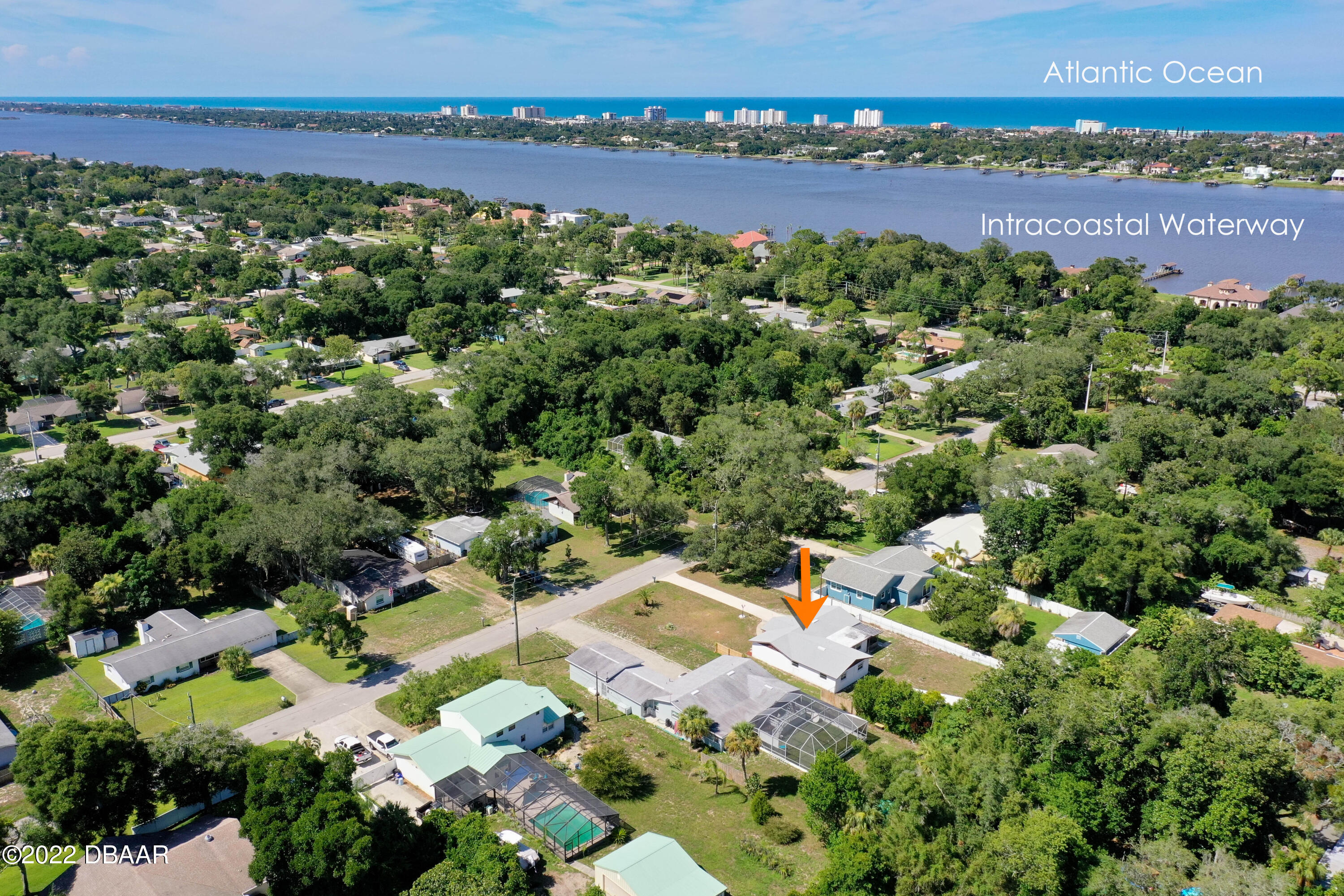 64 Cumberland Avenue Ormond Beach, FL 32174 - Photo 2 of 38 an aerial view of a house with a yard