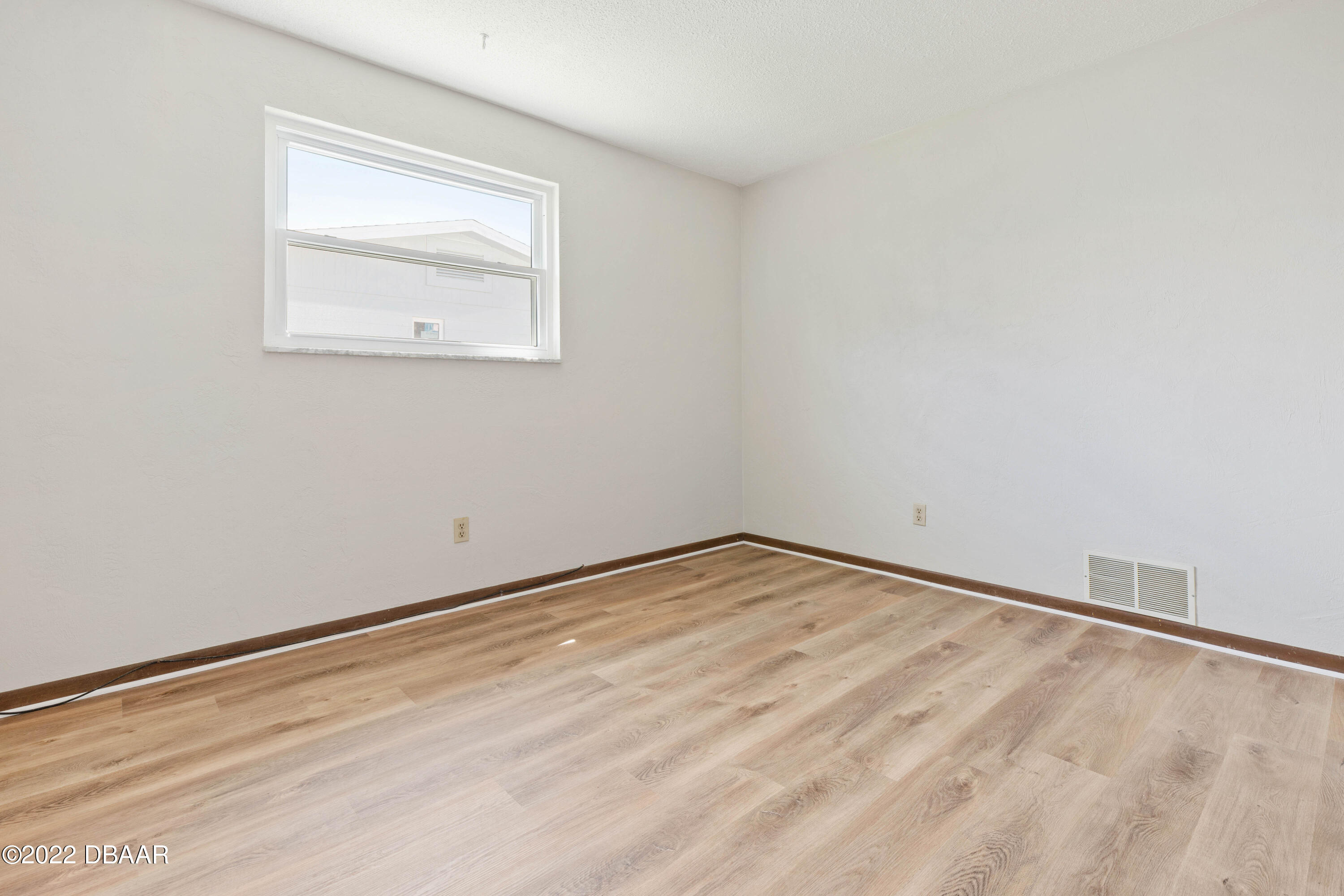 64 Cumberland Avenue Ormond Beach, FL 32174 - Photo 23 of 38 an empty room with a window