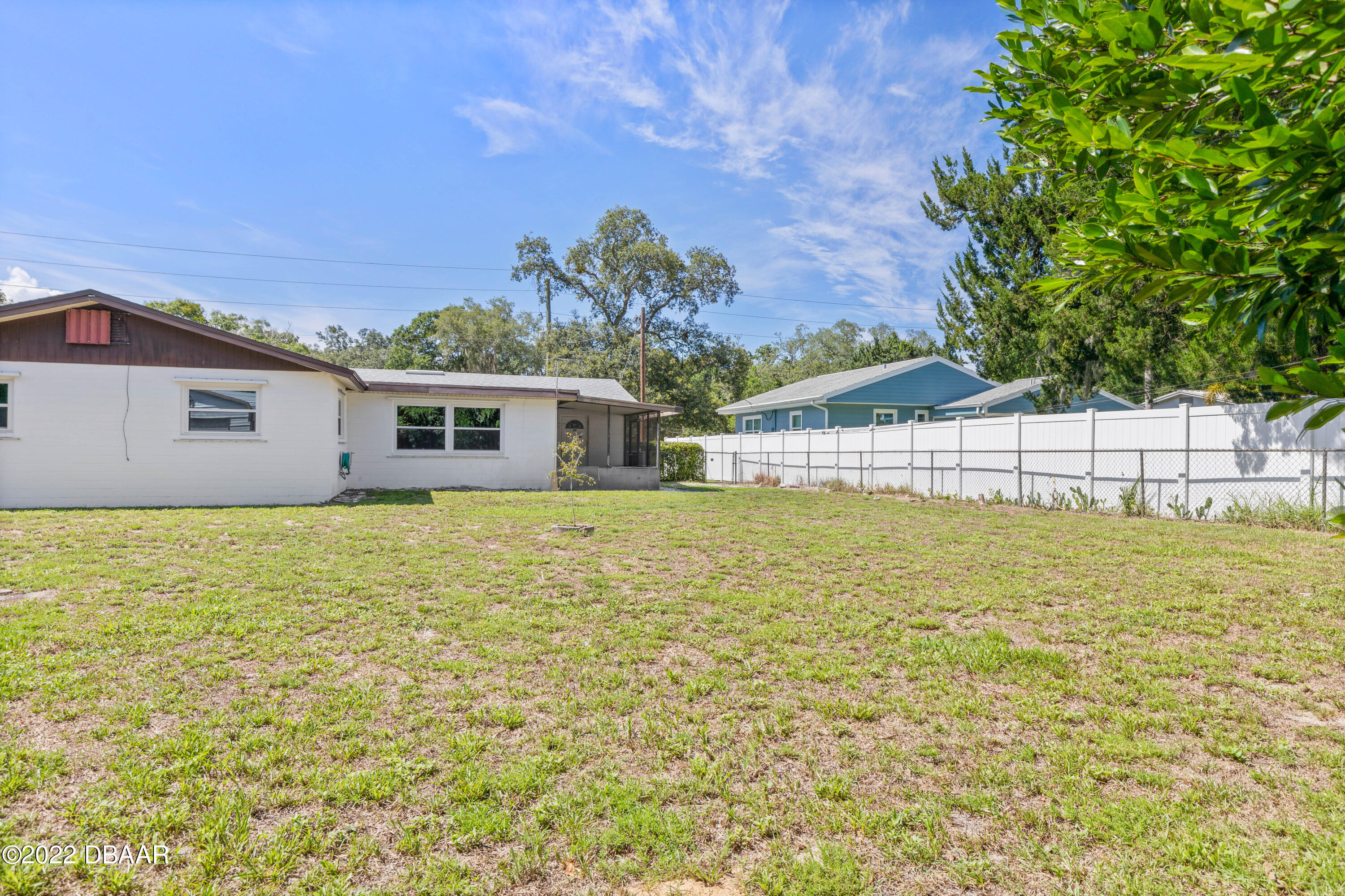 64 Cumberland Avenue Ormond Beach, FL 32174 - Photo 29 of 38 a view of a house with a backyard space