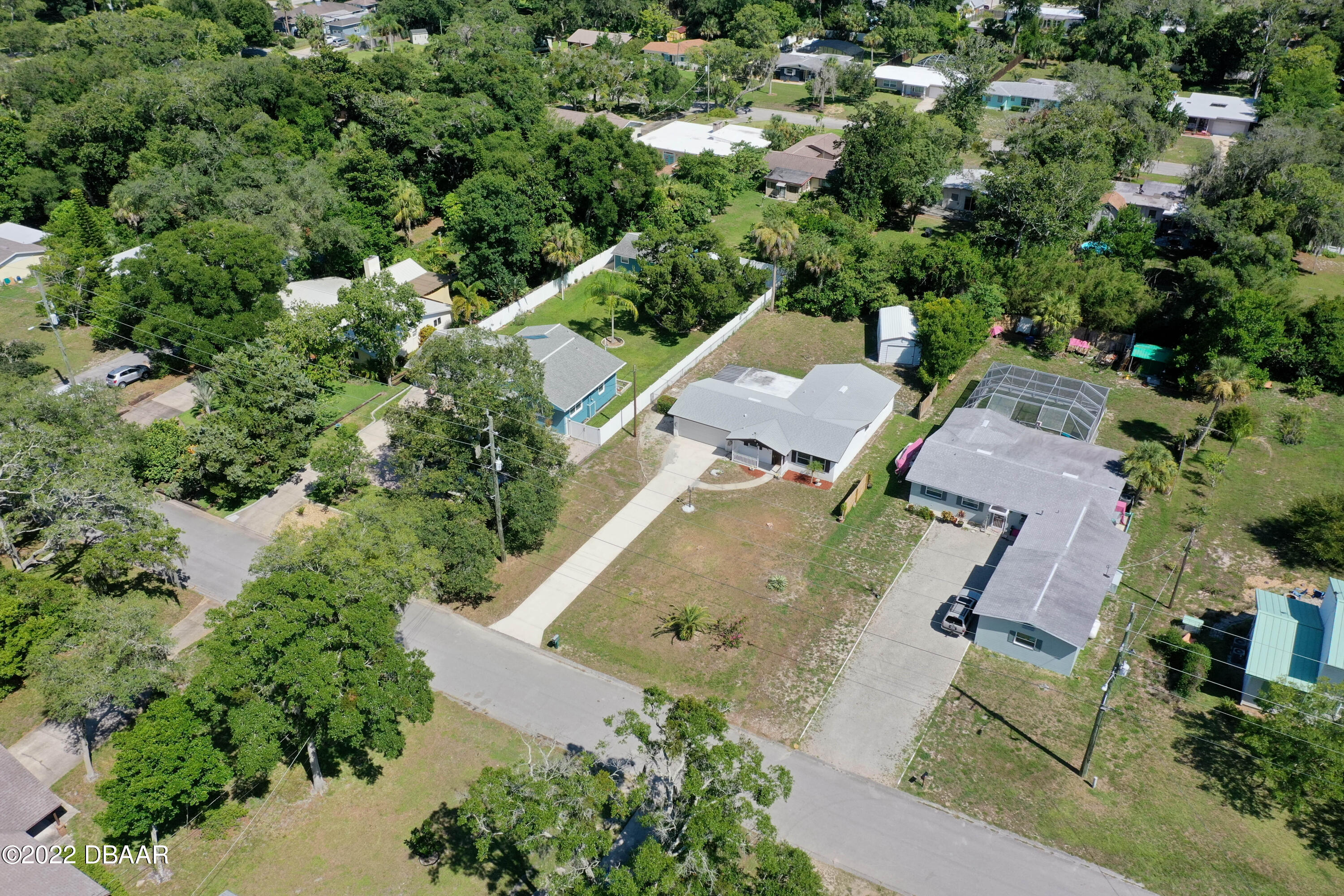 64 Cumberland Avenue Ormond Beach, FL 32174 - Photo 33 of 38 an aerial view of residential house with outdoor space and trees all around