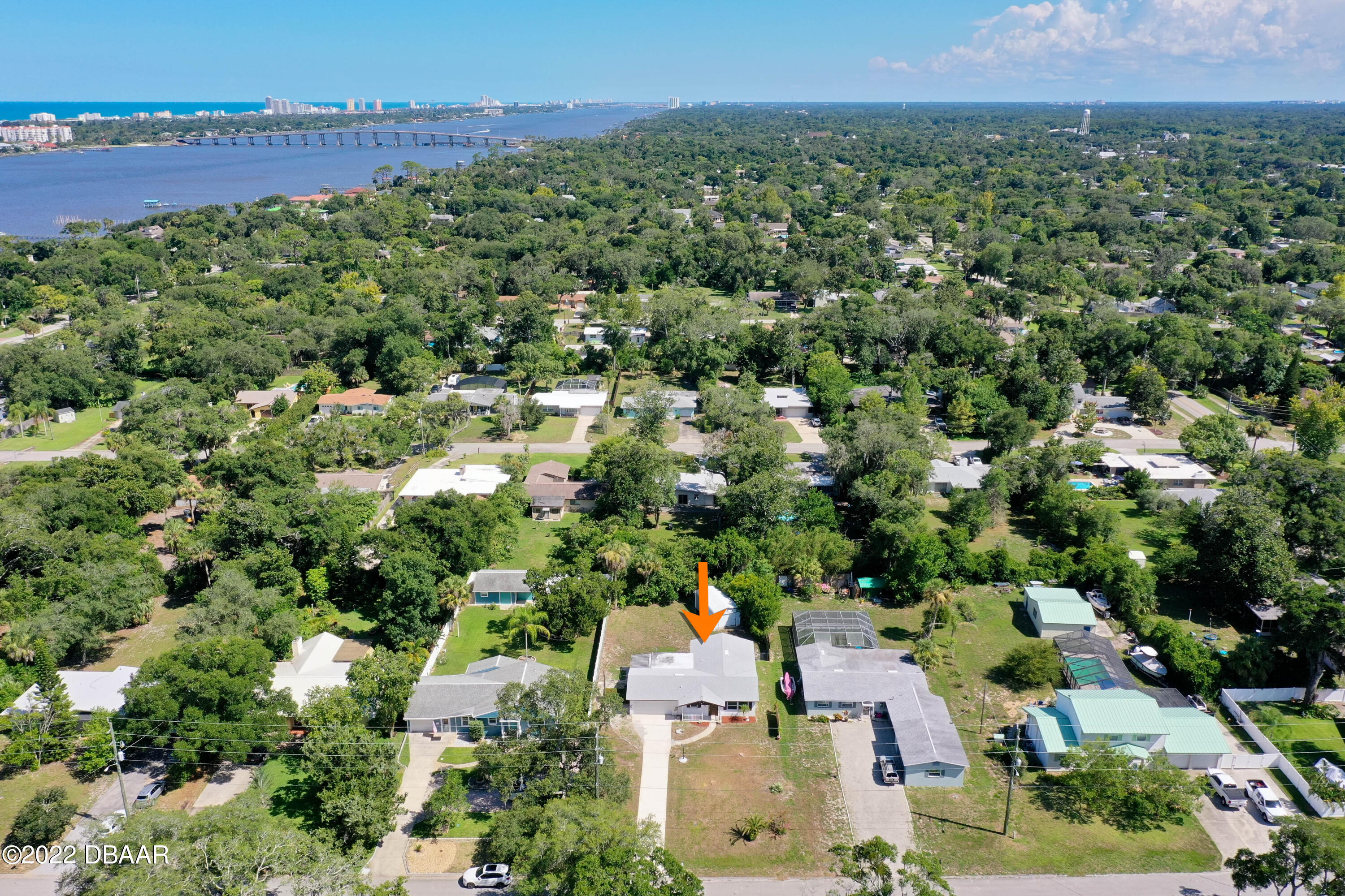 64 Cumberland Avenue Ormond Beach, FL 32174 - Photo 34 of 38 an aerial view of a city with lots of residential buildings