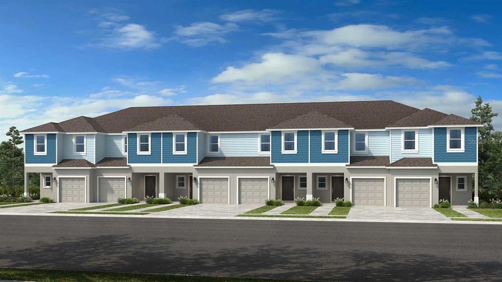 10770 Eclipse Street Sarasota, FL 34241 - Photo 1 of 48 a front view of residential houses with yard