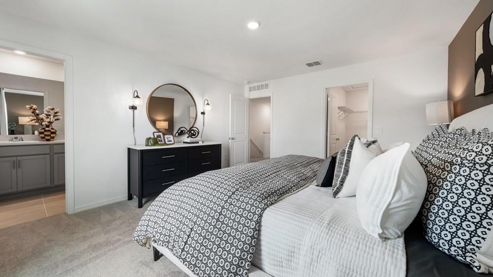 10770 Eclipse Street Sarasota, FL 34241 - Photo 16 of 48 a bedroom with a bed and a dresser