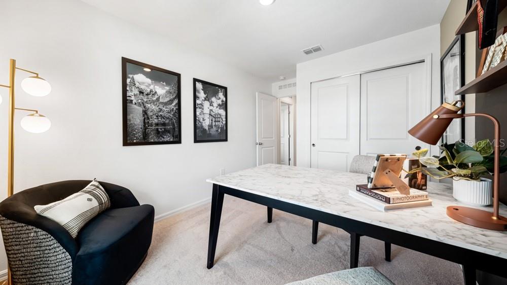 10770 Eclipse Street Sarasota, FL 34241 - Photo 21 of 48 a room with furniture and a window