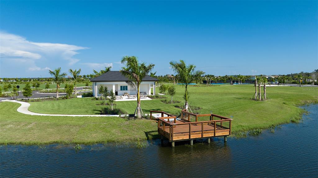 10770 Eclipse Street Sarasota, FL 34241 - Photo 29 of 48 a view of a lake with a house in the background