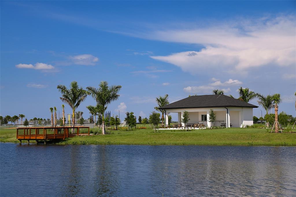 10770 Eclipse Street Sarasota, FL 34241 - Photo 34 of 48 a view of a swimming pool and lounge chairs