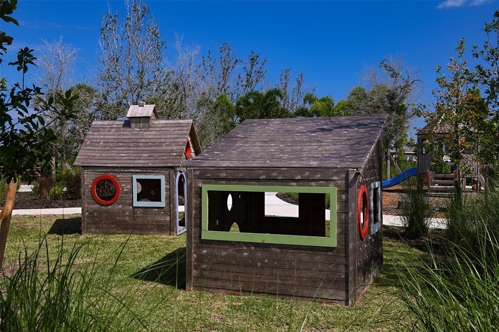 10770 Eclipse Street Sarasota, FL 34241 - Photo 43 of 48 a view of a wooden house with a yard