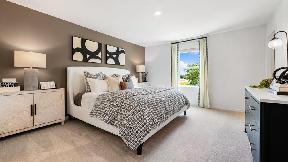 10770 Eclipse Street Sarasota, FL 34241 - Photo 8 of 48 a bedroom with a bed and painting on the wall