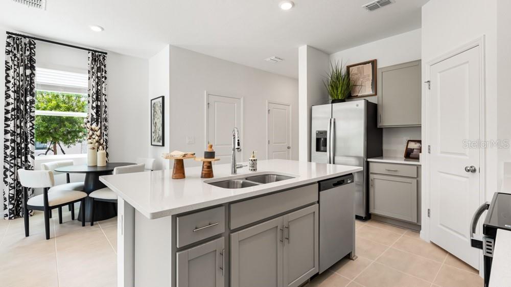10770 Eclipse Street Sarasota, FL 34241 - Photo 10 of 48 a kitchen with a sink appliances and cabinets