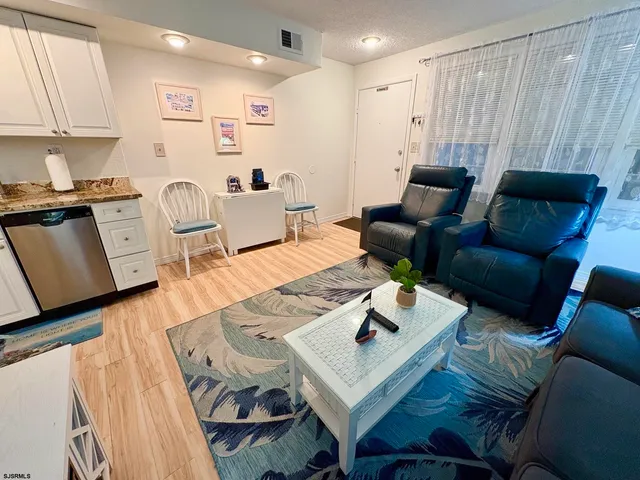 a kitchen with a stove a sink and a microwave