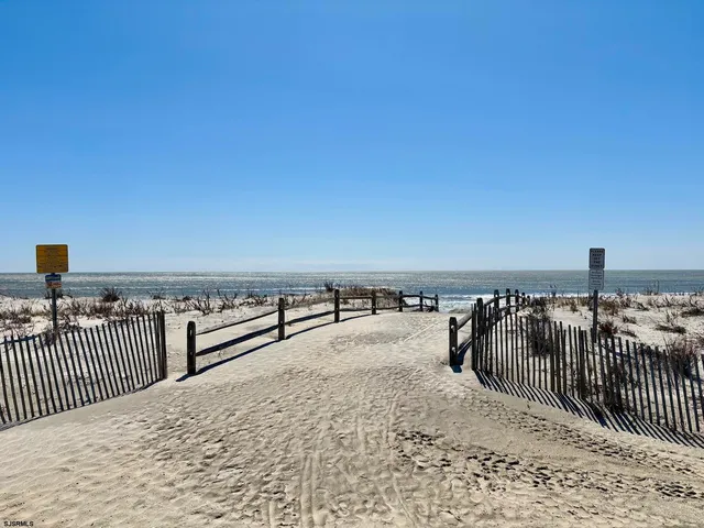 a view of a backyard with sitting area