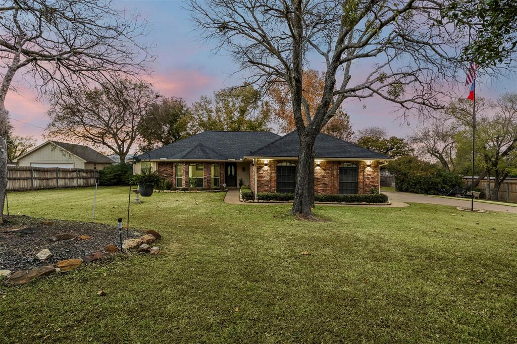 112 Saddle Hills Road Burleson, TX 76028 - Photo 2 of 38 a view of a house with backyard and trees