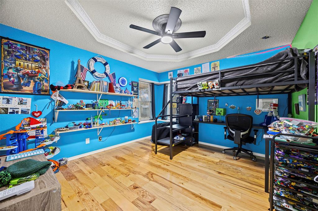 112 Saddle Hills Road Burleson, TX 76028 - Photo 25 of 38 a bed room with a bed and a chair