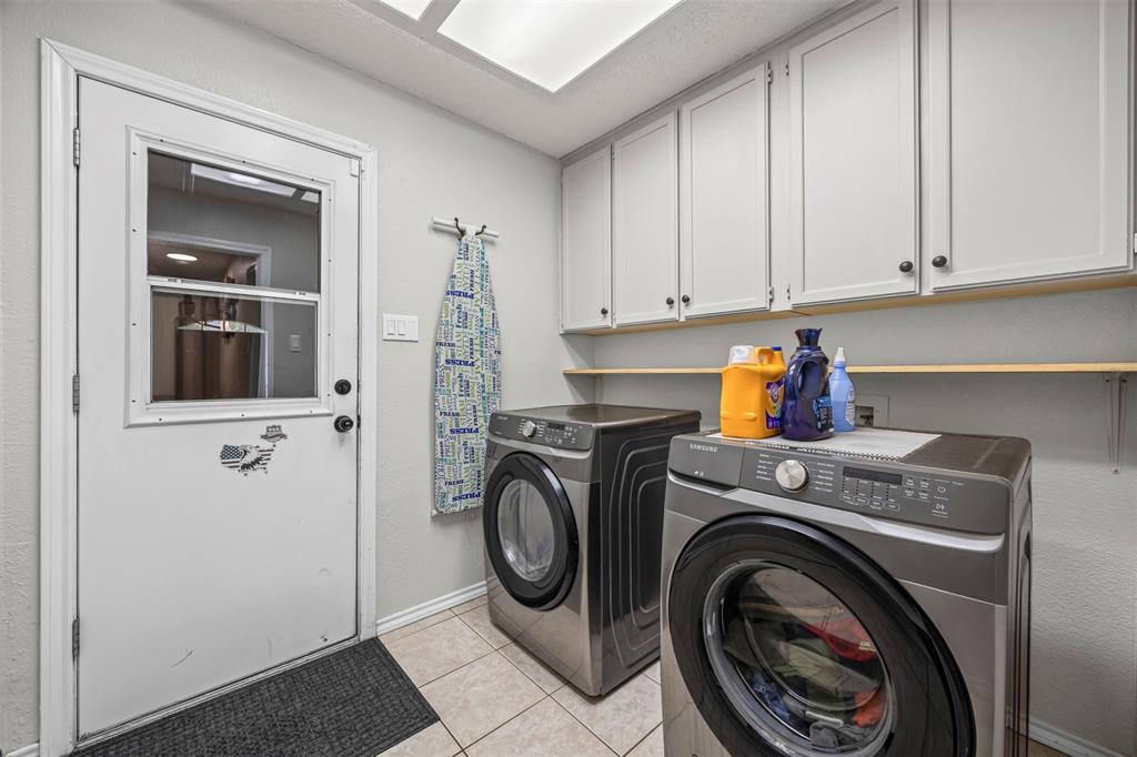 112 Saddle Hills Road Burleson, TX 76028 - Photo 26 of 38 a utility room with dryer and washer