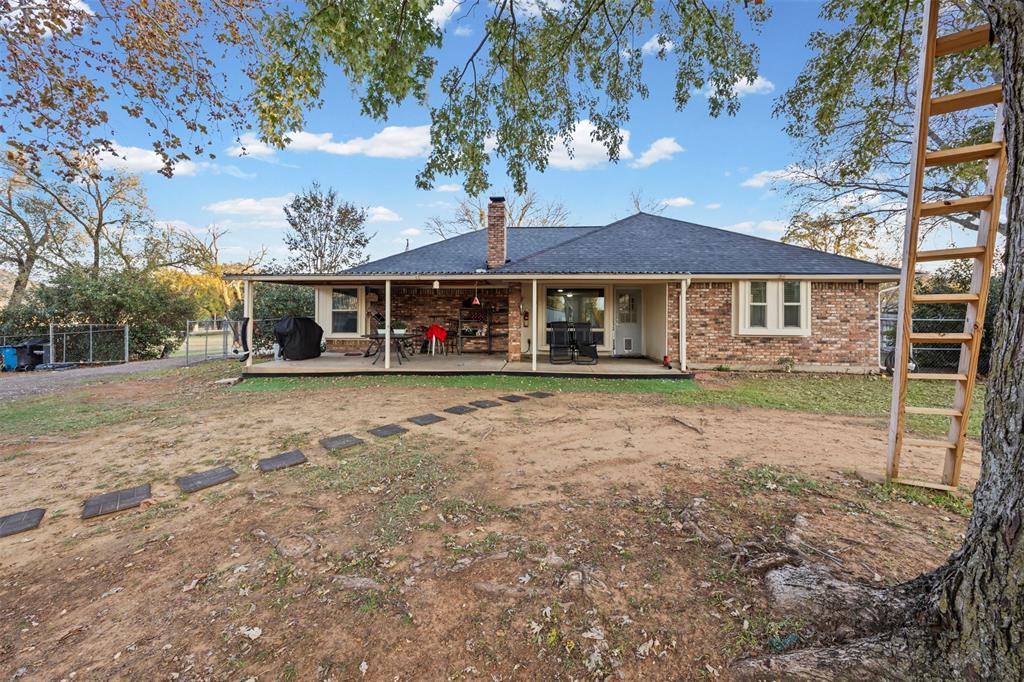 112 Saddle Hills Road Burleson, TX 76028 - Photo 28 of 38 a view of a house with a backyard
