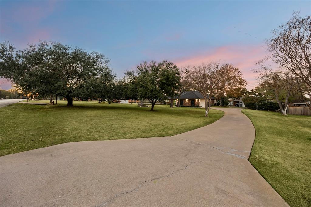 112 Saddle Hills Road Burleson, TX 76028 - Photo 3 of 38 a view of a park with large trees