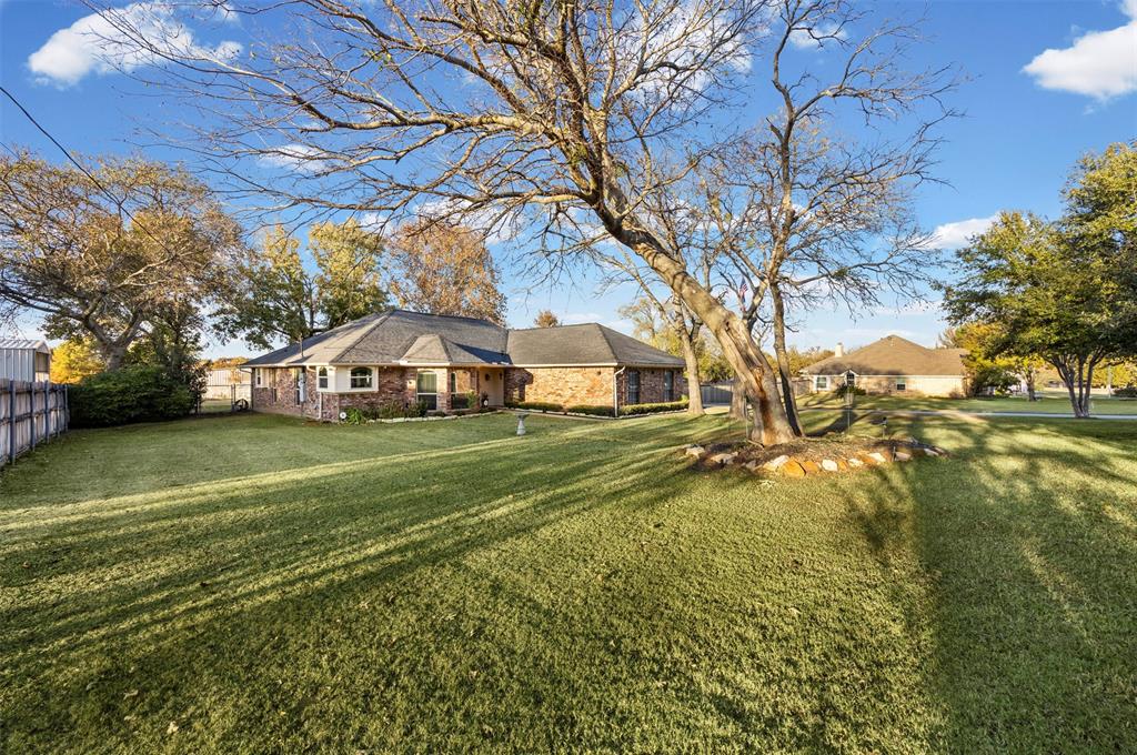 112 Saddle Hills Road Burleson, TX 76028 - Photo 6 of 38 a view of a house with a yard