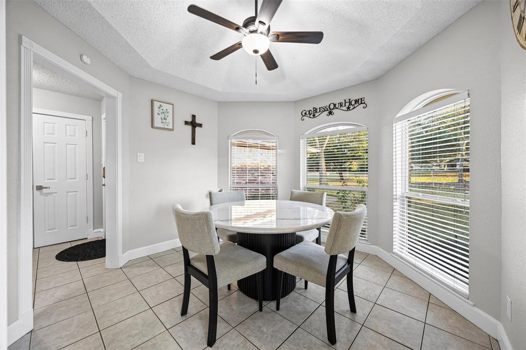 112 Saddle Hills Road Burleson, TX 76028 - Photo 9 of 38 a dining room with furniture and window
