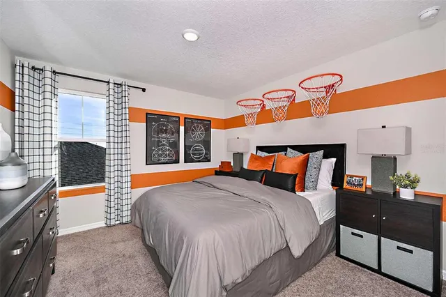 a bed room with a bed and a night stand