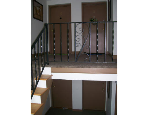 150 Main Street, Unit 9 Stoneham, MA 02180 - Photo 3 of 11 a view of staircase with white walls and a painting
