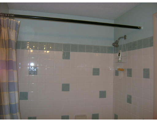 150 Main Street, Unit 9 Stoneham, MA 02180 - Photo 6 of 11 a bathroom with a shower