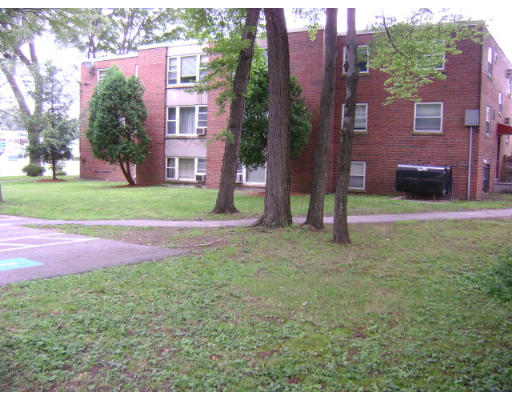 150 Main Street, Unit 9 Stoneham, MA 02180 - Photo 9 of 11 a view of a yard in front of a building