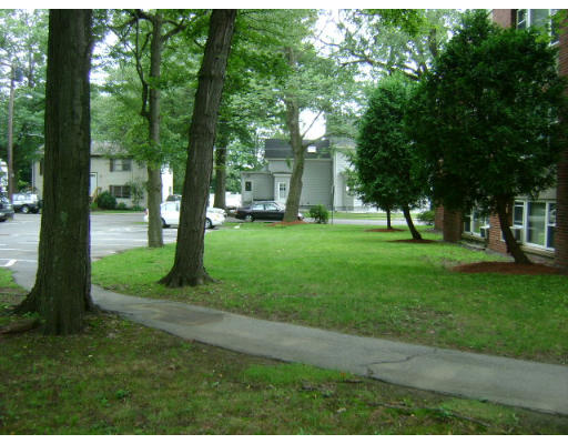 150 Main Street, Unit 9 Stoneham, MA 02180 - Photo 10 of 11 a green field with lots of trees