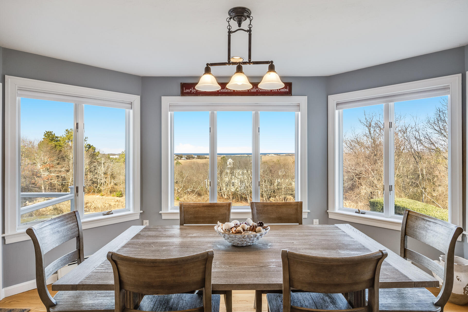 58 Williams Path West Barnstable, MA 02668 - Photo 29 of 74 a view of a dining room with furniture large windows and wooden floor