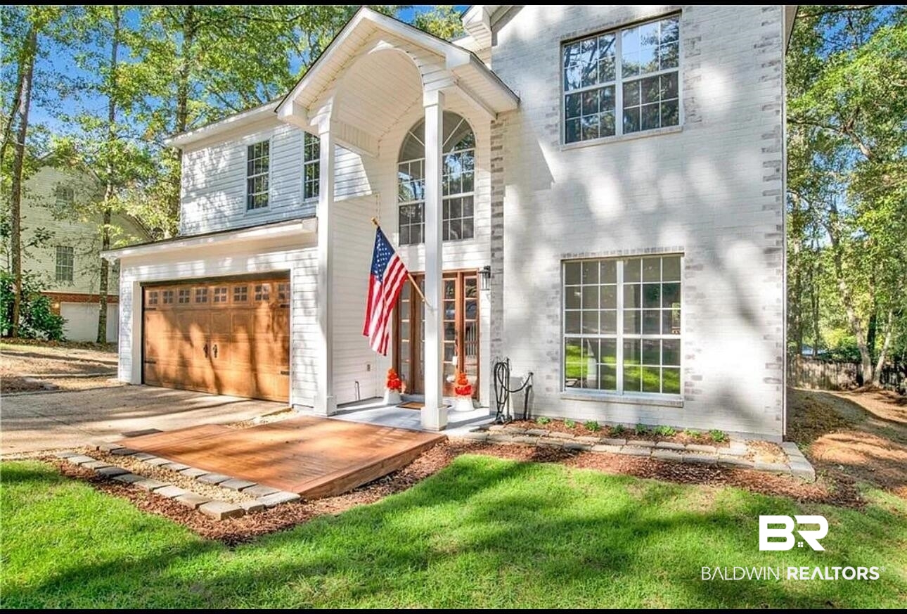 632 Ridgewood Drive Daphne, AL 36526 - Photo 1 of 36 View of front of house with a garage and a front yard