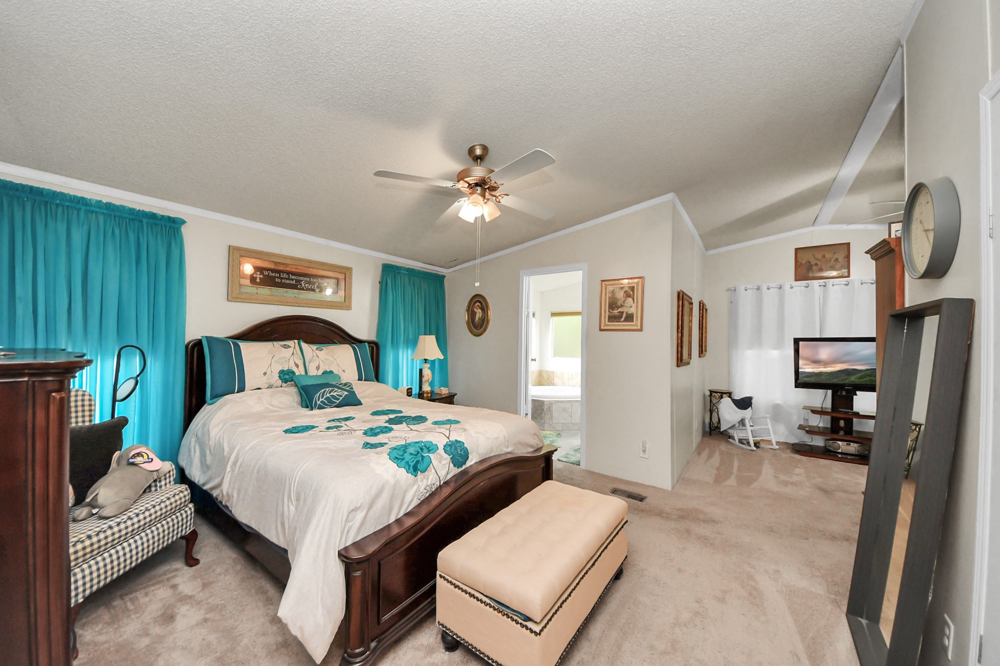 204 Edith Street Highlands, TX 77562 - Photo 8 of 33 a bedroom with a bed a table and chair