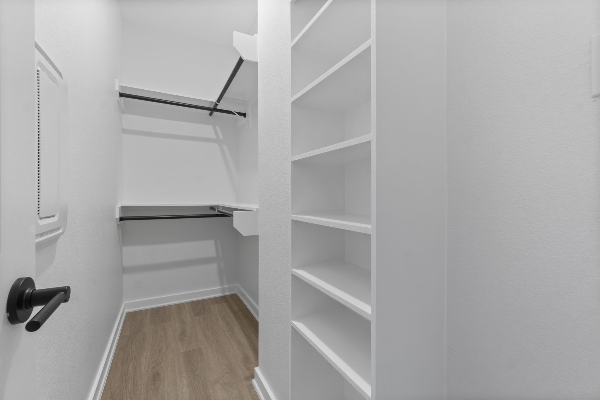 1007 Spokane River Road Conroe, TX 77316 - Photo 23 of 35 a view of walk in closet with empty racks