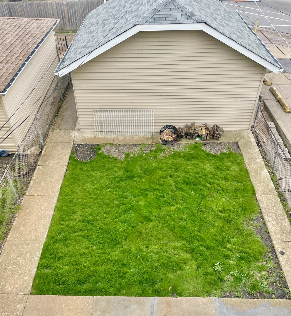 Undisclosed Address Chicago, IL 60618 - Photo 14 of 14 a view of a backyard with a garden