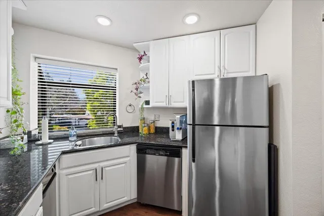 a bed room with a bed and a night stand