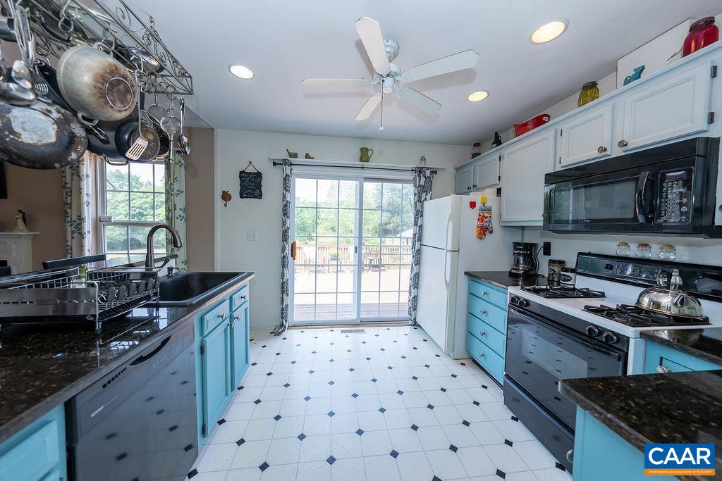 1697 Bybee Road Louisa, VA 23093 - Photo 3 of 35 a kitchen with granite countertop a stove and a sink