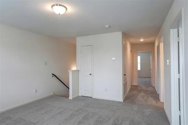 a view of a hallway view with staircase