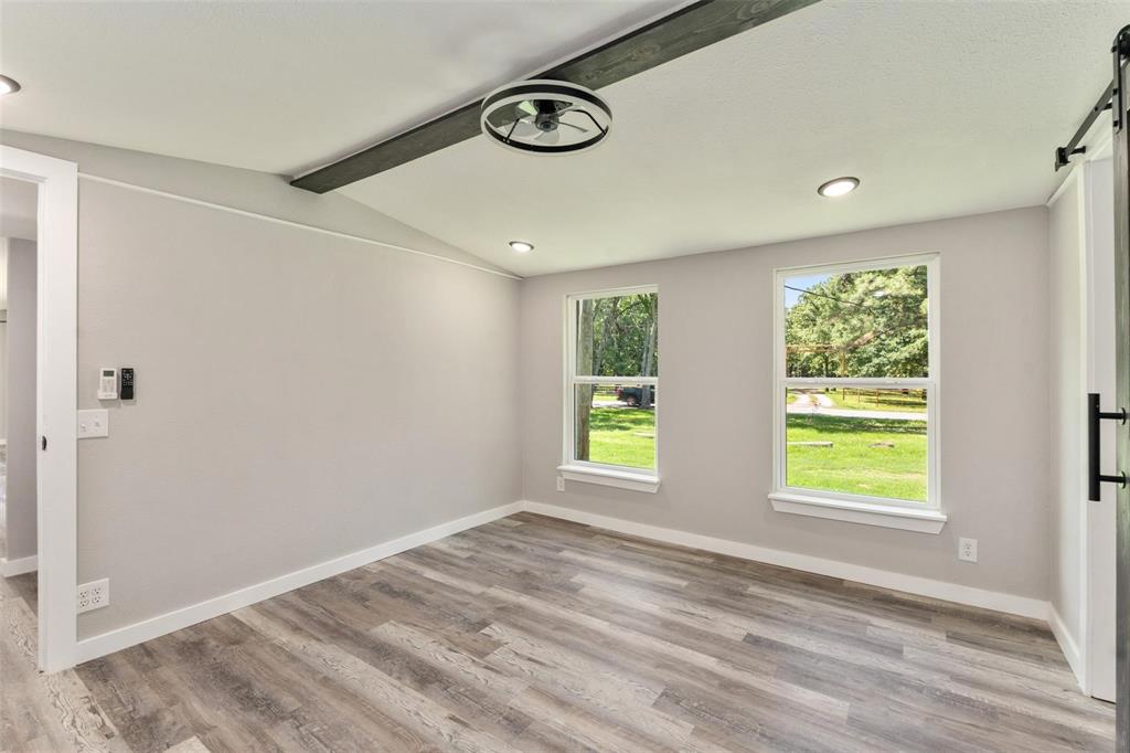 19930 Leisure Land Road Payne Springs, TX 75156 - Photo 11 of 21 a view of an empty room with a window