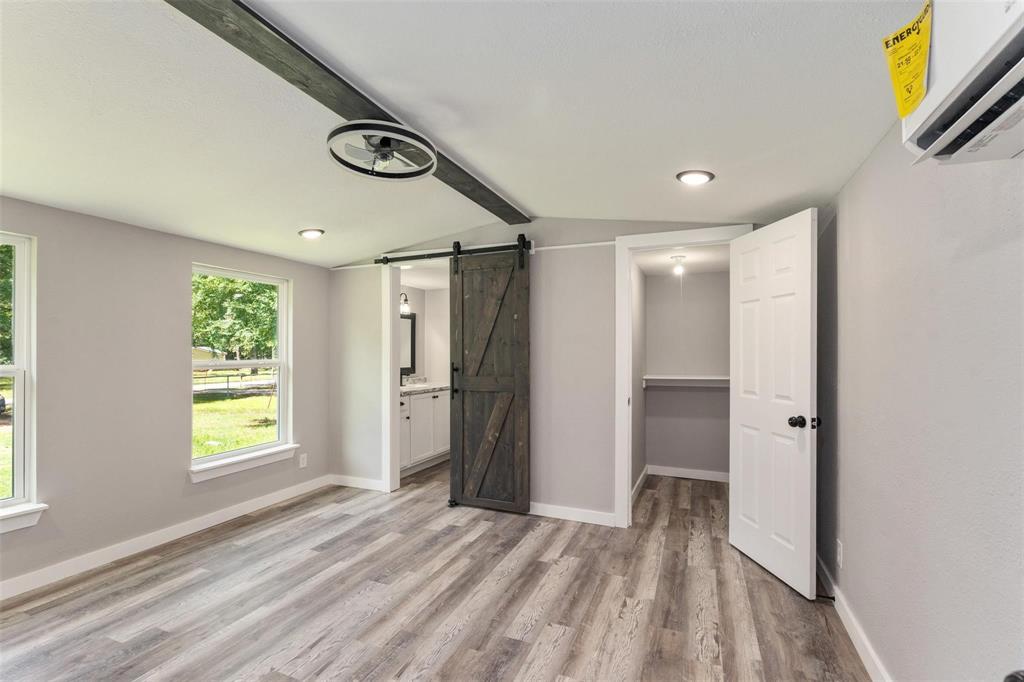 19930 Leisure Land Road Payne Springs, TX 75156 - Photo 12 of 21 a view of an empty room with a window