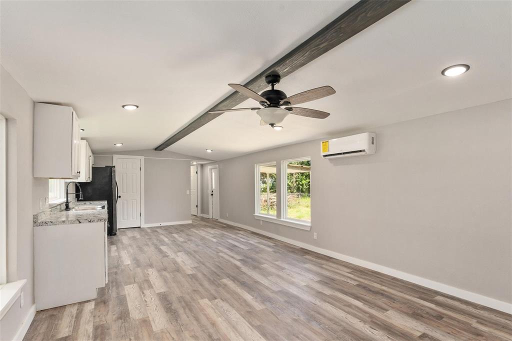 19930 Leisure Land Road Payne Springs, TX 75156 - Photo 6 of 21 a view of empty room with wooden floor and window
