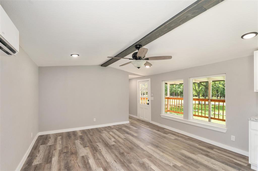 19930 Leisure Land Road Payne Springs, TX 75156 - Photo 7 of 21 a view of an empty room with a window