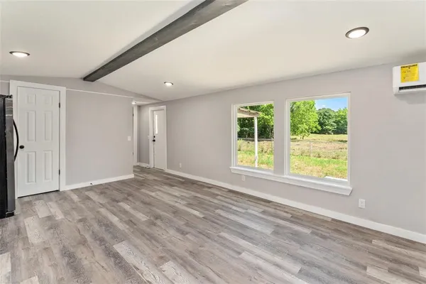 a view of an empty room with a window