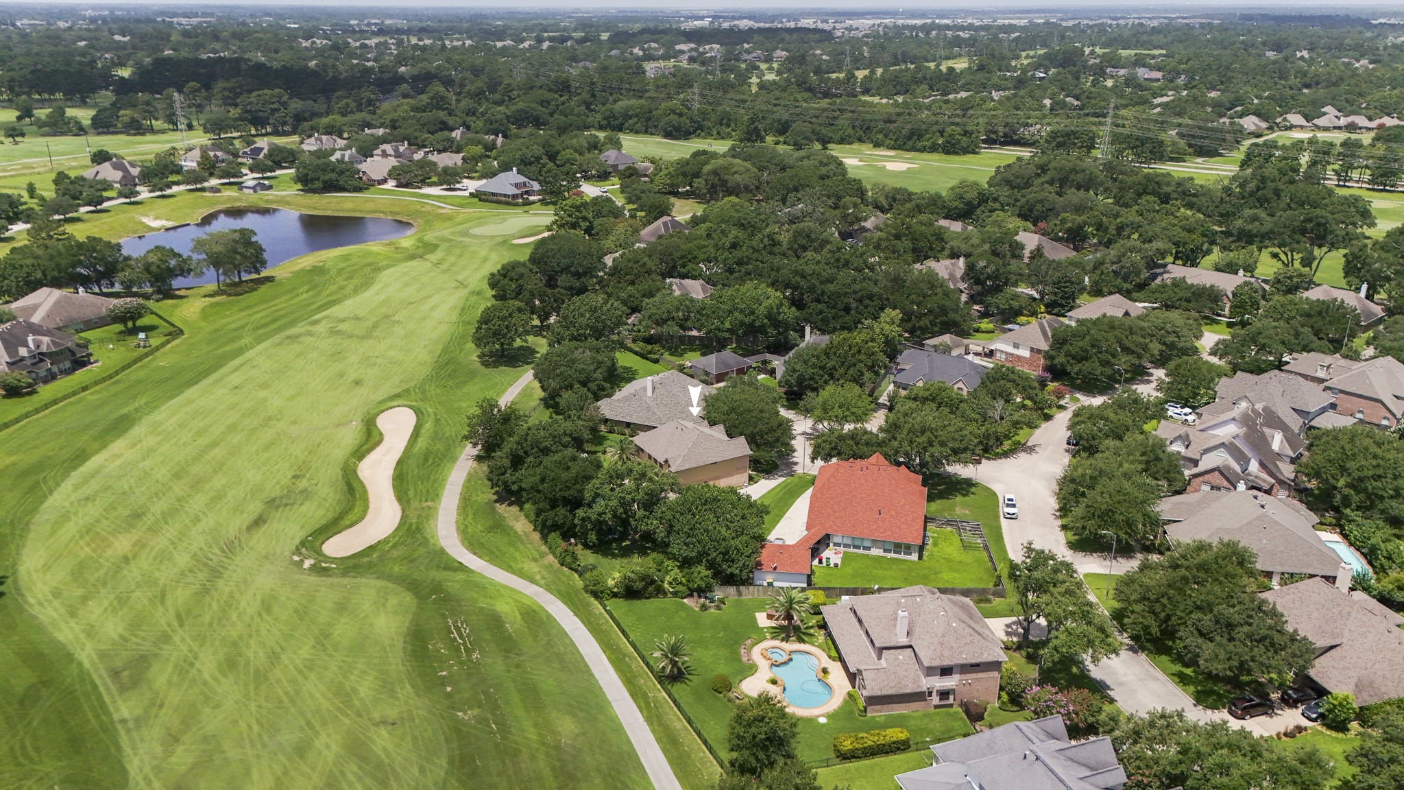 5807 Sequoia Trace Court Spring, TX 77379 - Photo 39 of 50 Here we see just how closely this home connects to the Windrose golf course lifestyle, with the fairway, cart paths, water features, and neighborhood setting all unfolding around it.