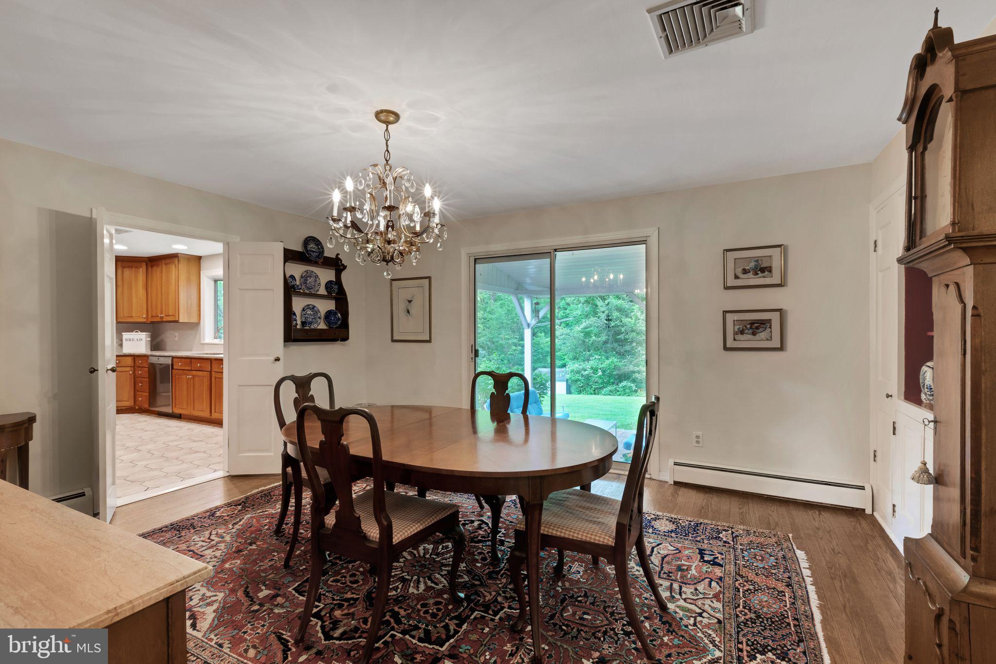 501 Oakbourne Road West Chester, PA 19382 - Photo 14 of 44 Dining Room w/ slider to Brick Patio