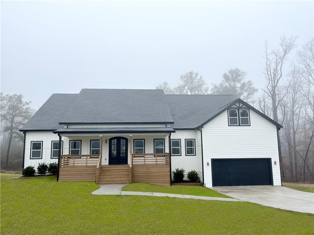 6850 John West Road Winston, GA 30187 - Photo 1 of 1 a front view of a house with a yard
