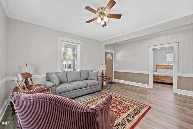a living room with furniture and a rug