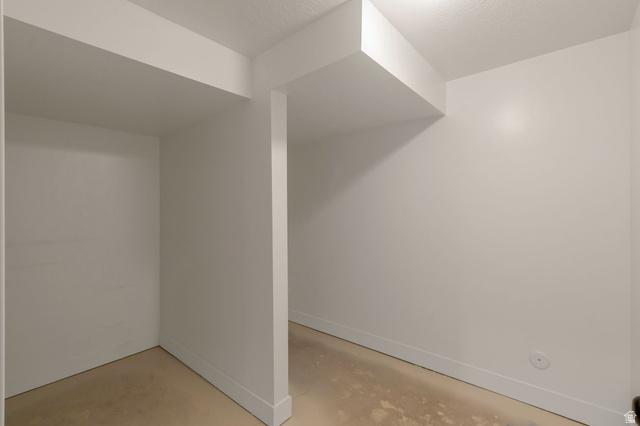 30 South Moonlit Road Mapleton, UT 84664 - Photo 22 of 25 Storage room in basement. White painted interior walls with white baseboards, textured ceiling, and recessed ceiling lighting